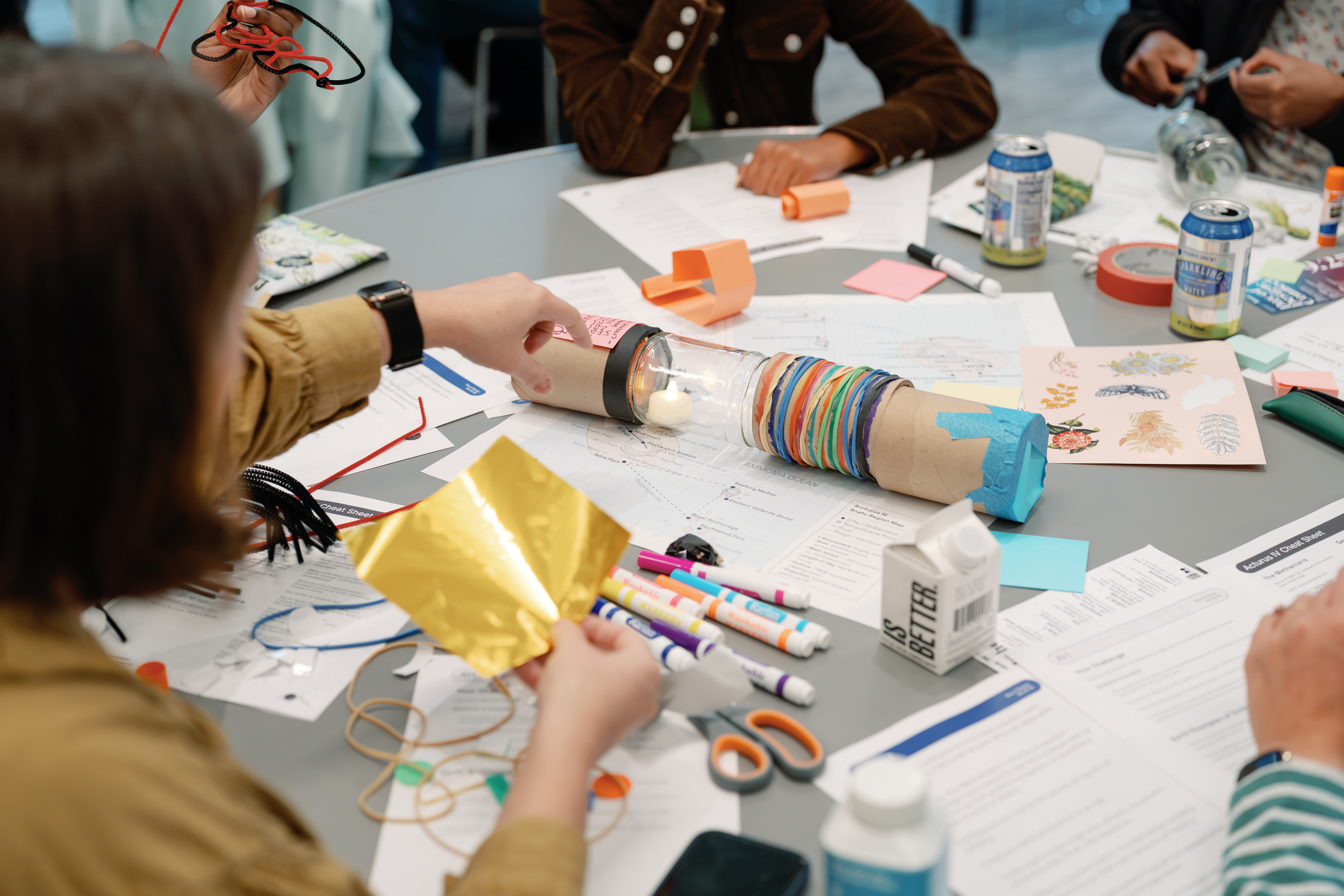 Workshop table with craft materials and prototyping supplies
